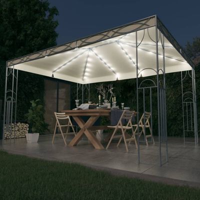 vidaXL dārza nojume ar LED lampiņu virtenēm, 400x300 cm, krēmkrāsas